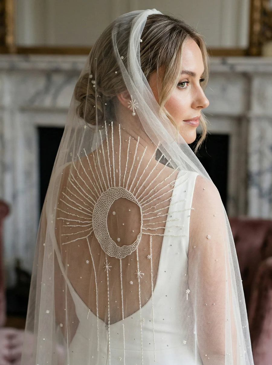 Bride wearing a hand-embroidered custom wedding veil
