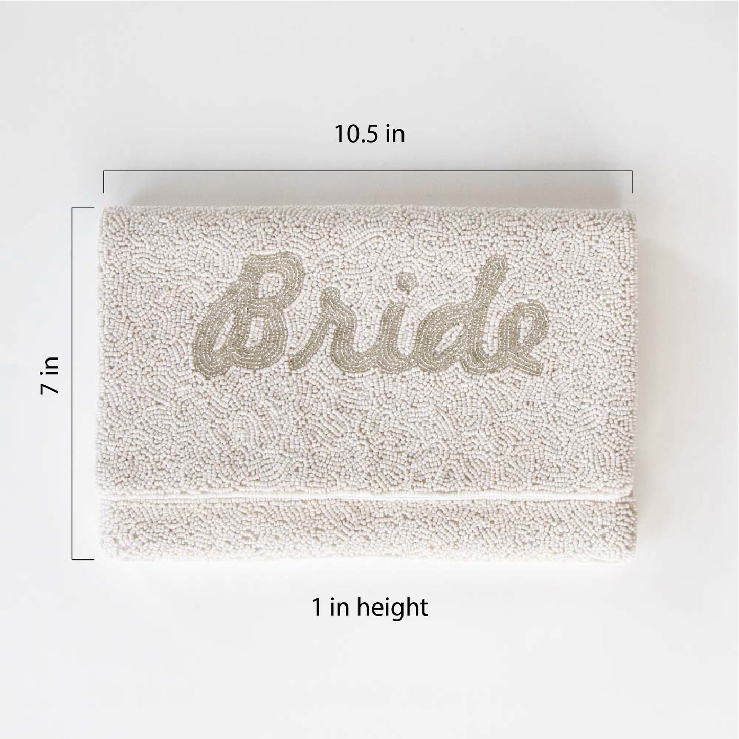White Bride Clutch Bag"Exquisite white beaded bridal clutch with silver 'Bride' text, handmade for perfection. This durable canvas clutch, sized at 10.5 x 7 x 1 inches, offers both elegance and functionality for the wedding day. Its unique design ensures a one-of-a-kind accessory for the bride."