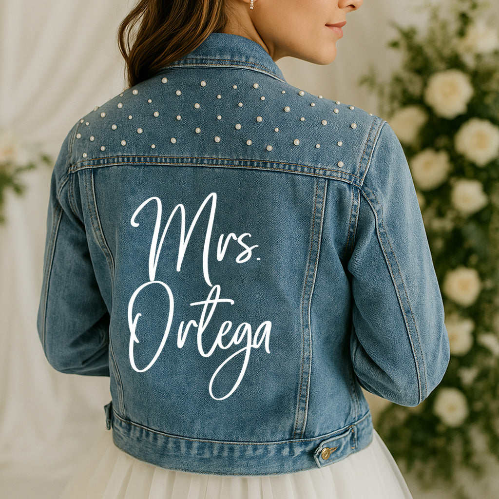 Personalized denim bride jacket with pearl embellishments and 'Mrs.' on back