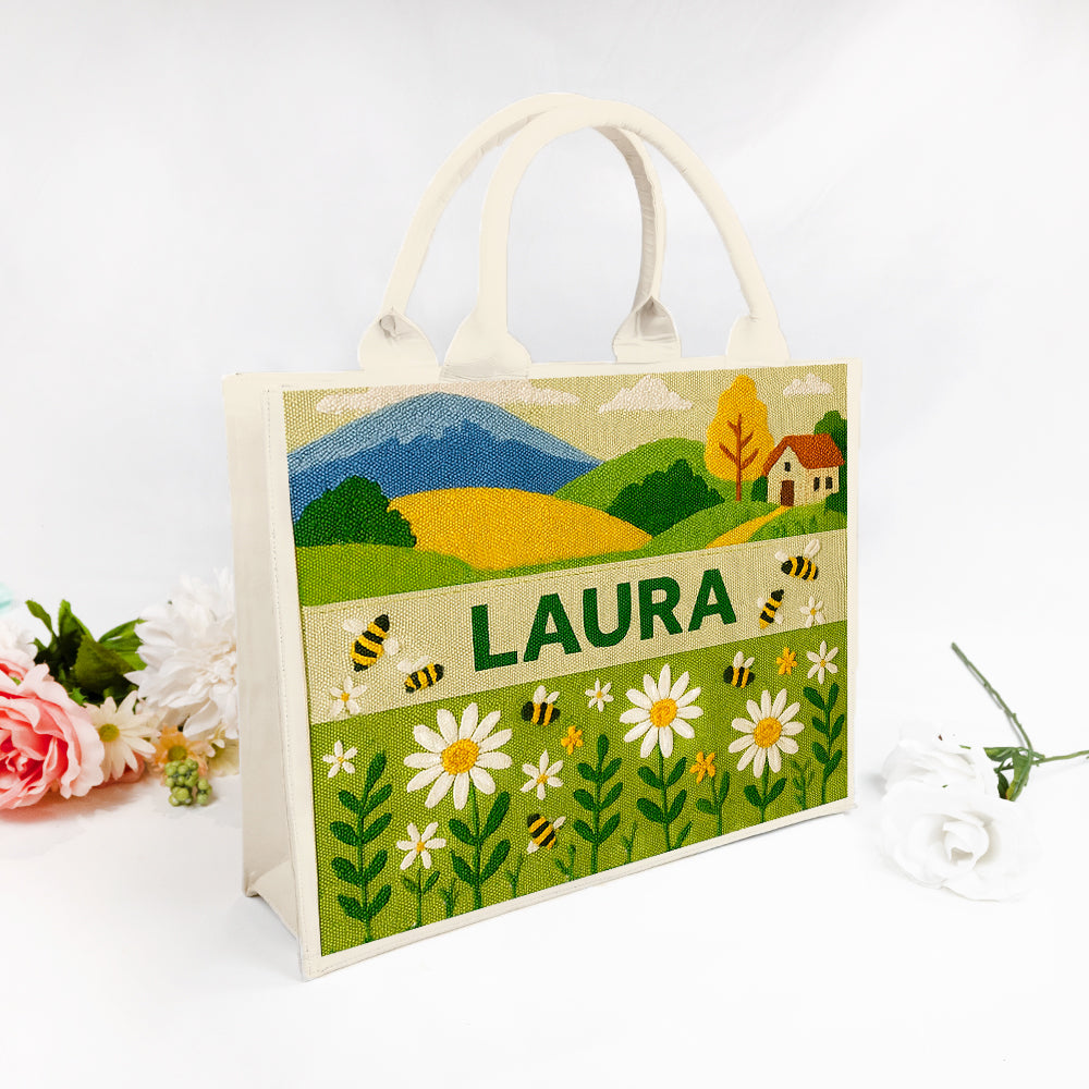 Custom premium tote bags with beaded text and themed designs in a flat lay