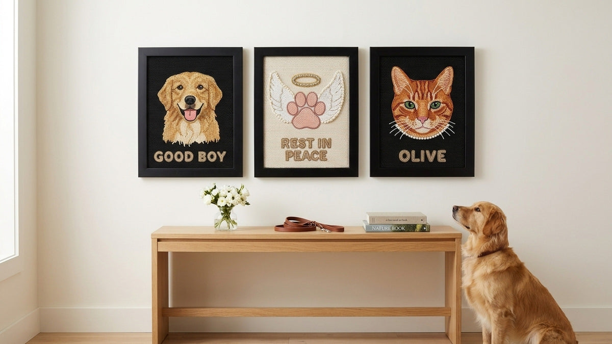 Hand-beaded pet portraits hanging in a row on a living room wall
