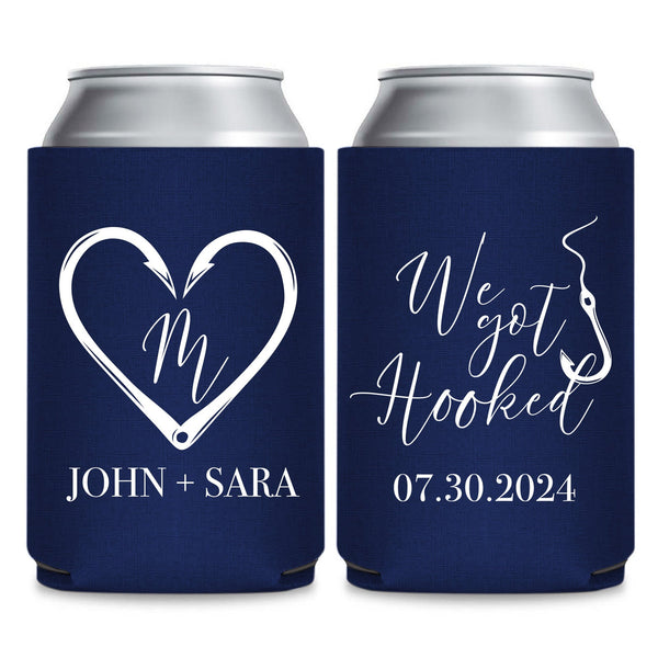 two navy blue beverage coolers with white text and graphics. The text on the coolers reads "John + Sara" and "07.30.2024".