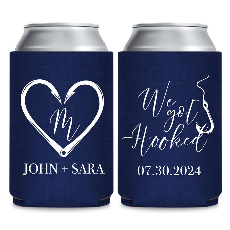 two navy blue beverage coolers with white text and graphics. The text on the coolers reads "John + Sara" and "07.30.2024".