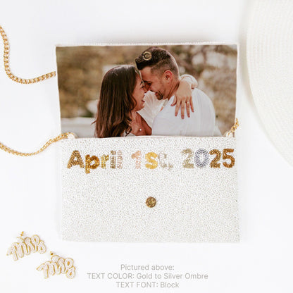 A beaded clutch bag with a custom photo, date, and gold chain.