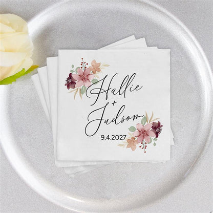 Napkin with floral design and text on a silver plate