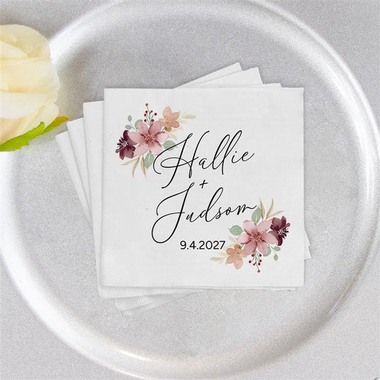 Napkin with floral design and text on a silver plate