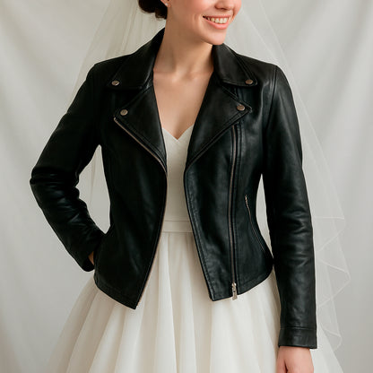 a woman in a white dress and a black leather jacket