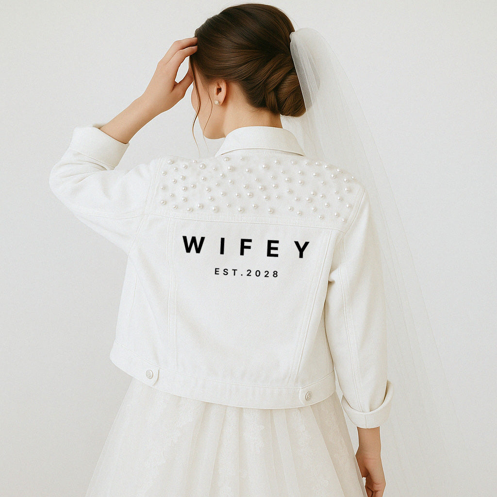 a woman in a white dress and a white jacket