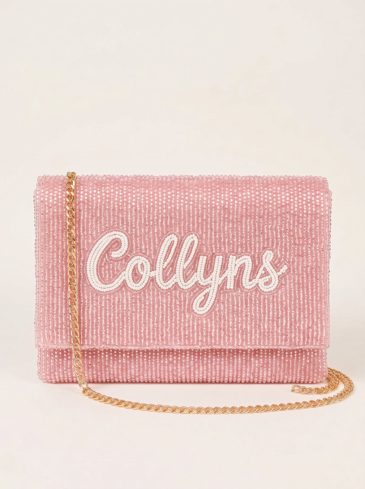 Hand-beaded clutch, pink, her name in white beaded script on the front
