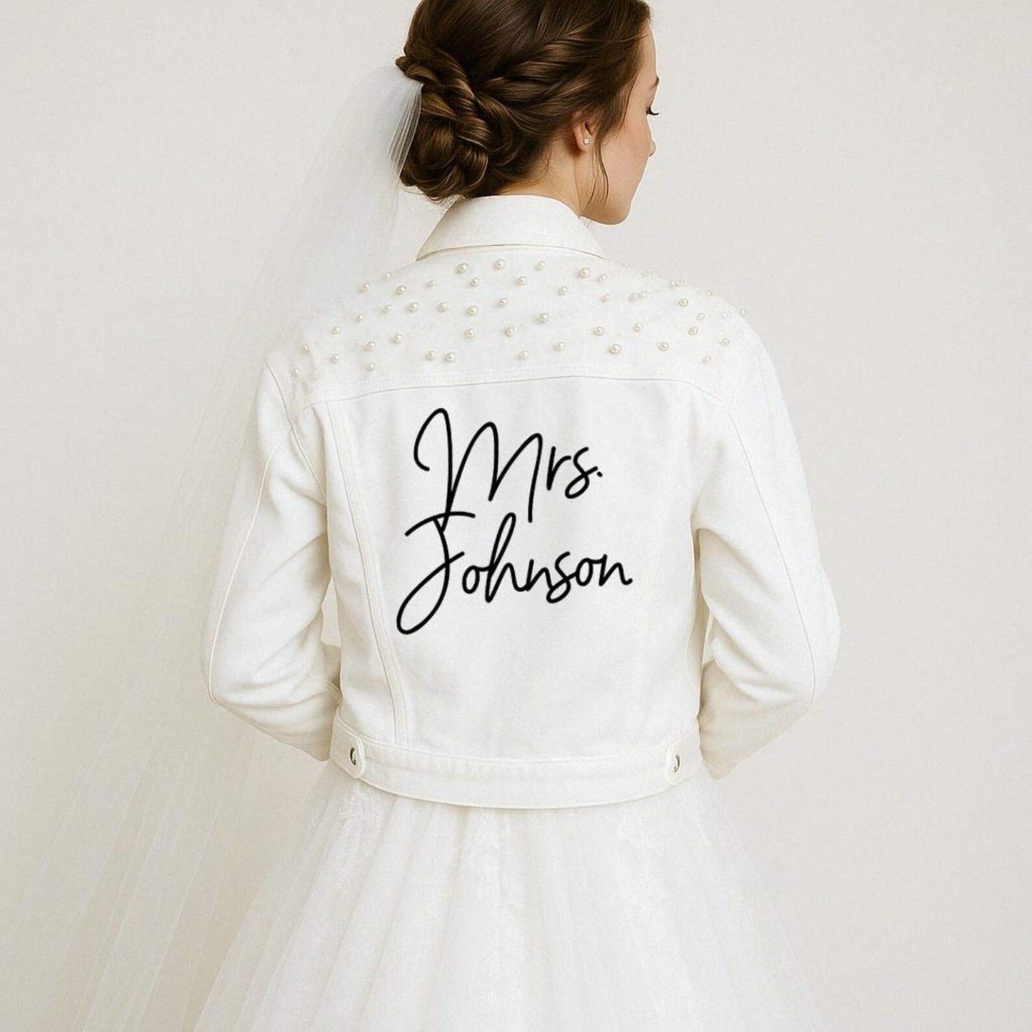 White jacket with 'Mrs. Johnson' text on a plain background