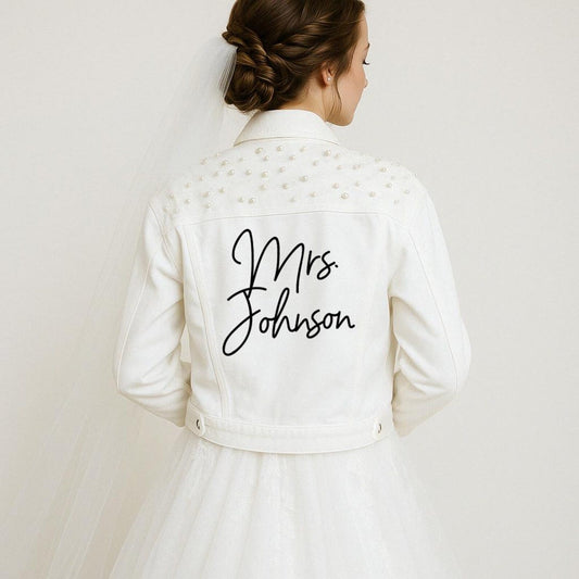 White jacket with 'Mrs. Johnson' text on a plain background