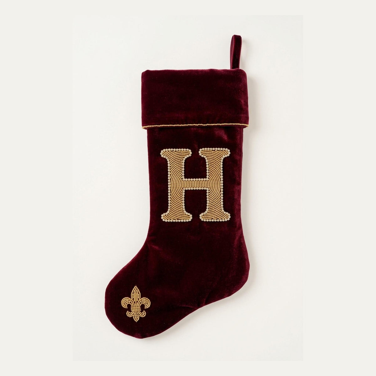 Oxblood velvet beaded Christmas stocking with a gold and crystal monogram initial