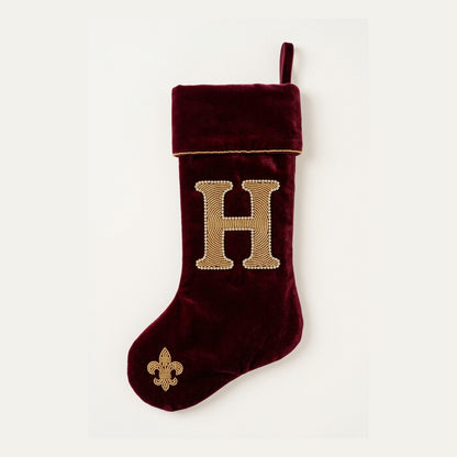 Oxblood velvet beaded Christmas stocking with a gold and crystal monogram initial