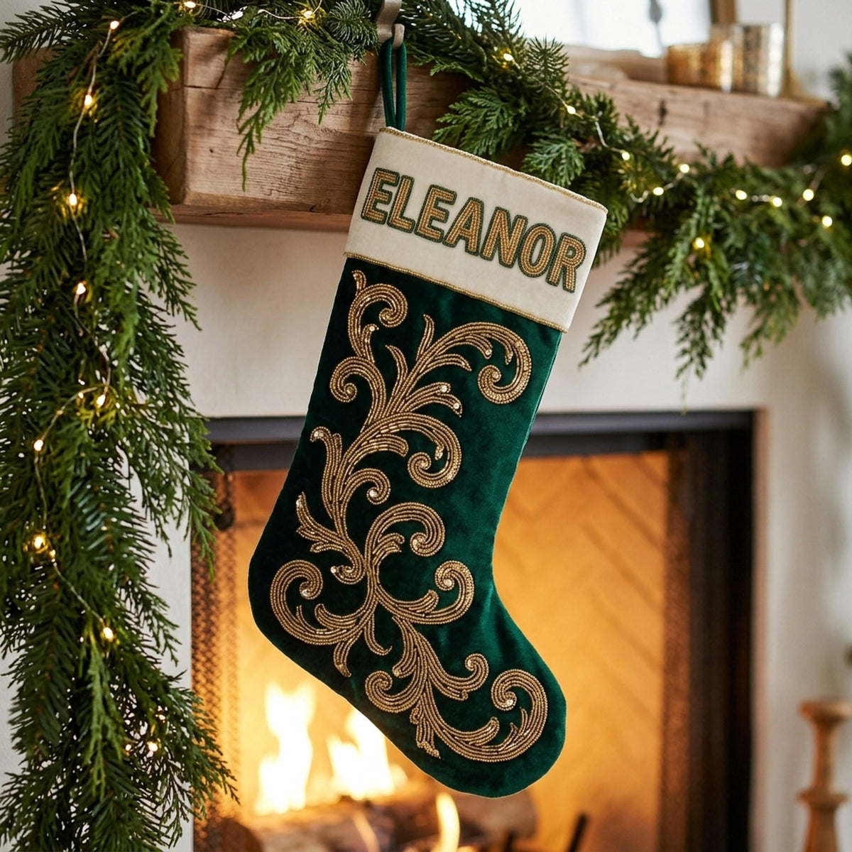 Emerald velvet beaded stocking hanging on a mantel