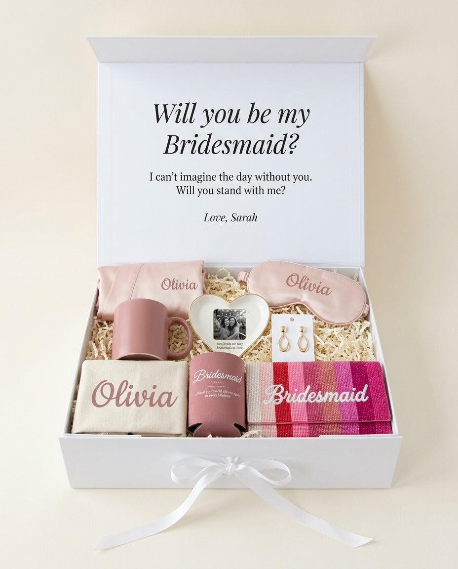 Luxe bridesmaid box open: letter printed inside the lid, hand-beaded pink rainbow Bridesmaid clutch, satin robe, mug, trinket tray with your photo, Bridesmaid can cooler, canvas tote, eye mask with her name, earrings (render)