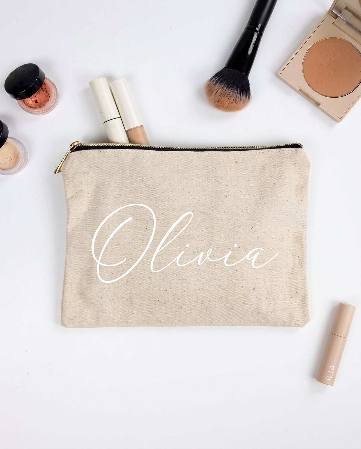 Natural canvas makeup pouch with her name in white script