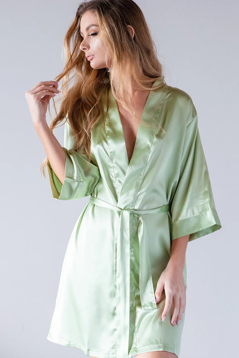 Side view of woman modeling personalized sage green satin kimono bridesmaid robe with tie waist — custom bridal party robe