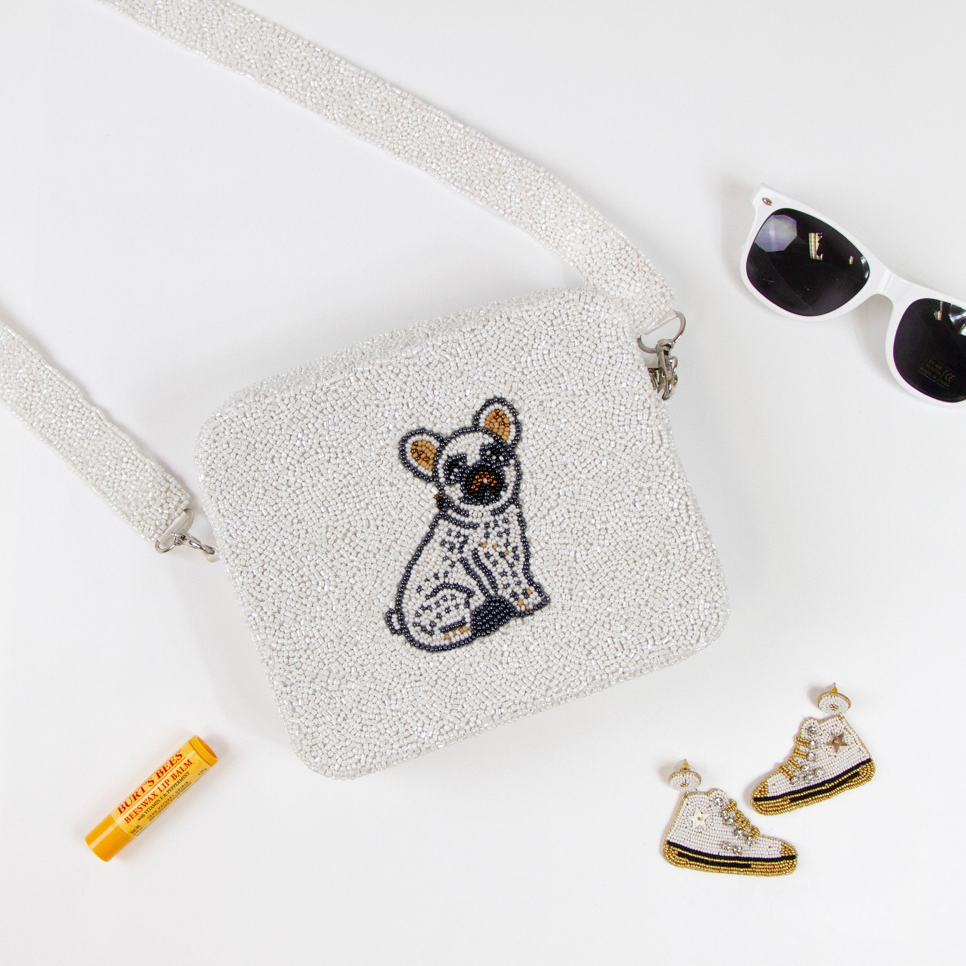 Customizable beaded crossbody bag with a unique design, perfect for summer outings. Features a removable 46-inch beaded strap and zipper closure. Handcrafted ensuring each piece's individuality in color, texture, and beadwork.