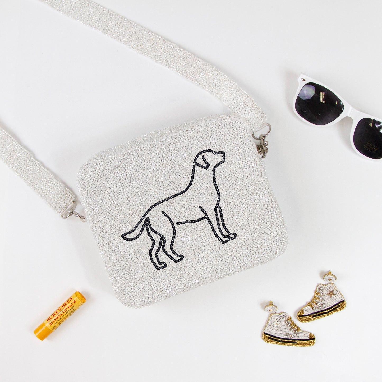 Customizable beaded crossbody bag with a unique design, perfect for summer outings. Features a removable 46-inch beaded strap and zipper closure. Handcrafted ensuring each piece's individuality in color, texture, and beadwork.