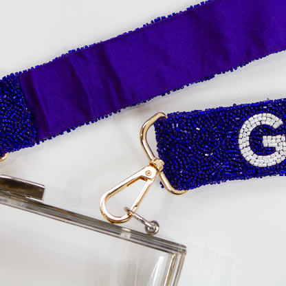 Customizable 46in crossbody beaded strap, perfect as a trendy Bridal Clutch strap, guitar strap, or camera strap. Available in both neutral and bright color palettes, this handmade strap is unique in its variations of color, shading, and beadwork. A versatile accessory that can elevate your game day bag or serve as a memorable bridal gift with personalized name details