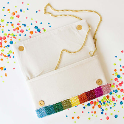 Stunning Bridal Clutch: Mrs. Rainbow Clutch Bag measuring 5.75 x 10.25 x 1 in, crafted from durable canvas. This handmade, beaded bridal purse boasts an intricate design, making it an elegant accessory for brides seeking a one-of-a-kind touch for their special day.